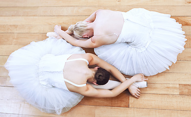Image showing Ballet women, theatre concert and dance stage for creative training, performance and professional dancers. Above of two girl ballerinas stretching dancing and start music show action on studio floor