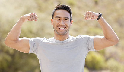 Image showing Sport, fitness and exercise with a flexing man showing his muscles and biceps while proud of his strong build. Workout, training and health with a muscular young male athlete or bodybuilder outdoor