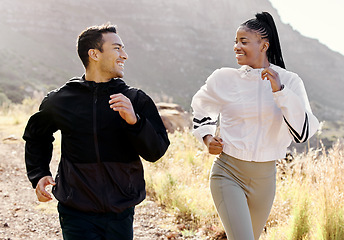 Image showing Couple, running and mountain on hiking, training or wellness trip in nature together with smile expression. Man, black woman and exercise on hill, workout outside for motivation and health of body