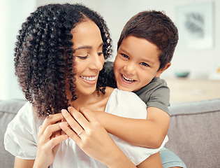 Image showing Happy kid hug mom for mothers day, love and care while relaxing together on sofa lounge at home. Boy child playing with smile parent for happiness while bonding, enjoying quality time and fun