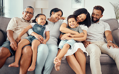 Image showing Love, children with grandparents in a big family as mother and father hugging kids on the sofa or couch. Dad mom and young children happy to enjoy bonding with lovely grandmother and old man at home