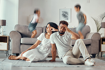 Image showing Stress, tired and parents with adhd kids playing on couch making mom sad, exhausted and frustrated with dad. Headache, mother and overwhelmed father with loud children jumping on sofa in family home