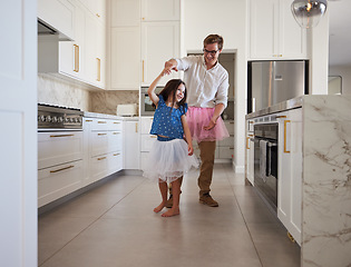 Image showing Happy family, dance and kitchen with father and daughter having fun, playing and enjoy freedom at home. Creative parent dressing up and dancing to support and encourage his daughter ballet hobby