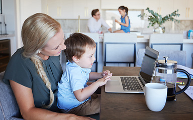 Image showing Mother, kid and laptop at table in living room with father and girl in background. Work from home mom on coffee break with son. Child development, family time and relax, a mothers love for children