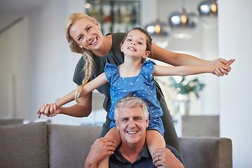 Image showing Happy senior grandfather on couch in home together on sofa with adult daughter and grandchild in retirement and love. Portrait of woman play and smile with kid, father and girl relax in living room