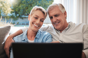 Image showing Happy senior couple with digital tablet on the sofa watching a movie, social media and funny meme while relax. Man and woman smile while streaming on an app and bonding together in the living room