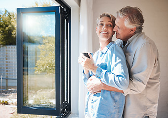 Image showing Happy, marriage and couple hug, smile and love at home with a drink. Senior husband and wife talking, affection and enjoying feeling carefree while having a cup of coffee in the morning together