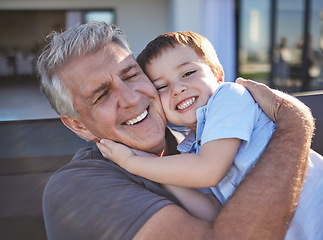 Image showing Happy, smile and grandfather hugging his grandchild while playing together at the family home. Happiness, playful and elderly man in retirement embracing and bonding with his toddler grandson.