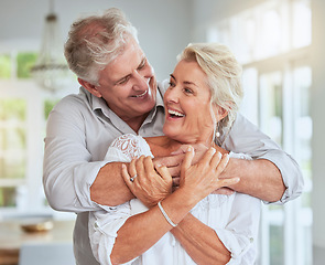 Image showing Senior couple, happy and hug for love, support and care in relationship at home embrace, bond or smile. Romance, married or retired old elderly man and woman in retirement celebrate marriage together