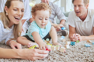 Image showing Big family in living room with baby play with toys and fun together on floor on a weekend. Happy grandparents, mother and father with boy for development in their family home sitting on the ground