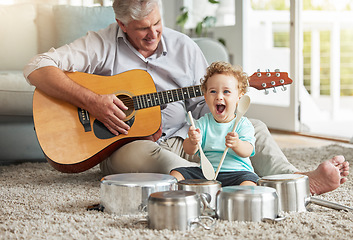 Image showing Music, pots and baby drummer with old man on living room floor with pan and wooden spoon instruments with his guitar. Memory, smile and senior grandparent enjoys time with a happy grandchild