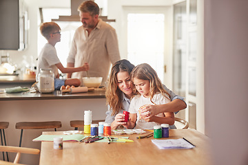 Image showing Mother painting with child and father cooking with kid in their family home together for growth development and learning. Parents or people teaching children, having fun in kitchen or a holiday house