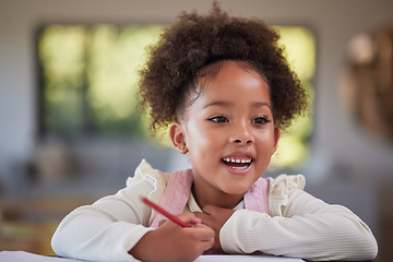 Image showing Child, learning and writing for education, homework and drawing with jamaica preschool girl using pencil at home. Happy and curious student kid doing art during homeschool studying at table to learn