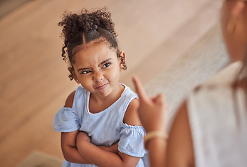 Image showing Angry child and tantrum discipline conflict for attitude problem in home with stressed mother. Young girl frustrated, unhappy and moody at disappointed adult punishment for negative behaviour.