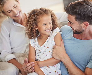 Image showing Happy family on sofa, smile together in living room and funny dad joke in Madrid home apartment. Child laughing at comic white father, parents relax in lounge and hug cute young girl happiness