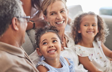 Image showing Happy, smile and family relax on living room couch and talking, conversation and doing a catch up. Love, diverse grandparents and grandchildren bonding, fun and quality time in family home together.