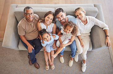 Image showing Love, smile and diversity portrait of happy family relax on living room sofa and bonding during annual family reunion above view. Grandparents, parents and children enjoy fun quality time together