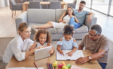 Image showing Family, education and grandparents helping kids with development learning schoolwork in drawing book and tablet. Old man and elderly woman teaching children with mother and dad relaxing on home couch