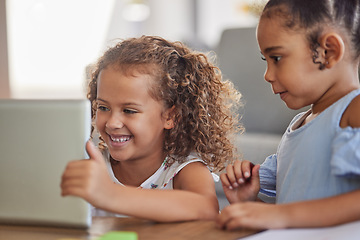 Image showing Happy children with digital tablet watch education or funny cartoon videos or games on the home sofa. Latino sisters enjoy watching or learning with tech and online subscription in the living room