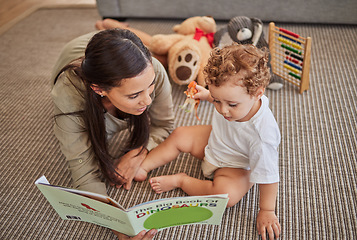 Image showing Mother, baby and book for story for education on carpet in home, for learning and reading skills. Child, mom and teaching with storybook for development of mind, brain or thinking ability in house