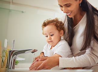 Image showing Mother, boy or washing hands help in water in covid bacteria cleaning, home morning wellness or learning hygiene. Child, son or kid by house bathroom sink in healthcare security or safety with parent