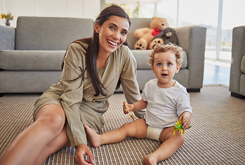 Image showing Mother, baby and smile in living room playing together on carpet in home, for fun and learning with toys. Child, mom and floor with dinosaurs figure, for development of hands, mind or brain in house