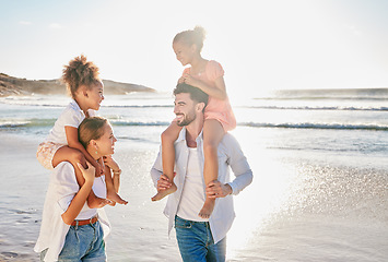 Image showing Nature, smile and happy family at the beach to relax in freedom, peace and memories together in summer. Travel, mother and father in an interracial relationship carrying children on holiday at sea