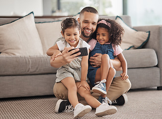 Image showing Family, selfie and happy children sitting on lounge carpet at home with phone and taking photo or doing video call together. Love, bonding and care of single parent man with girl kids in brazil house