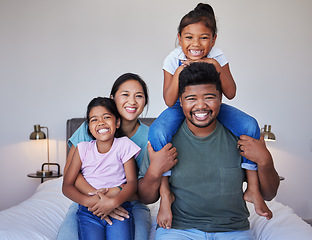 Image showing Happy family, portrait on bed in home bedroom and face smile bonding together. Love, happiness and caring Indian parents or father, mother and girls spending free time in comfort, support and care.