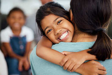 Image showing Girl, mother and bonding hug in house or home living room in trust, support or security embrace. Portrait, smile or happy child in adoption success in India, mothers day celebration or family reunion