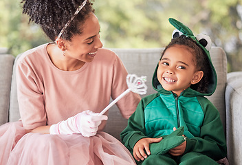 Image showing Love, family costume and smile on happy girl, child or kid playing dress up, having fun and bonding with mother. Happiness, princess mom and dinosaur child enjoy quality time together for Halloween