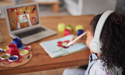 Image showing Education, art and online with a girl elearning or studying online with a laptop and the internet as a student. Computer, creative and tutotrail with a female child watching a video to study