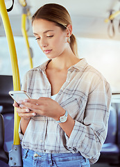 Image showing Travel, smartphone and woman on a bus or public transportation reading social media, online news or city website information. Young person with cellphone on train with lens flare for contact us