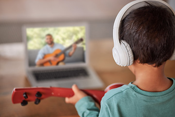 Image showing Education, laptop and child with guitar learning how to play on remote lesson, e learning or streaming tutorial video. Talent, online musician course or creative kid study music with teacher or coach