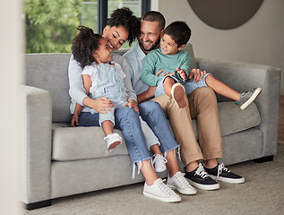 Image showing Happy family relax on home sofa in Brazil, parents smile at children on casual day together. Lounge in living room, young african kids bond with black mother and funny father make dad jokes on couch