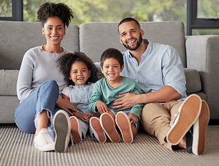 Image showing Happy family, portrait and bonding on a living room floor, smile and relax in their home together. Love, children and content parents loving and enjoying the day indoors with excited, smiling kids