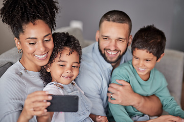 Image showing Family selfie, live streaming phone and smile on the internet with technology, happy for mobile app and record video for web on the sofa in living room. Latino mother and father take photo with kids