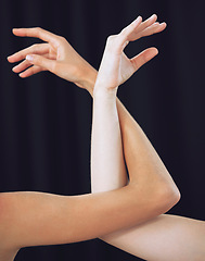 Image showing Women, hands and ballet dance arms on black studio background in art for theatre, training or performance. Female ballerina hand and arm choreography of dancers in creative team stance for diversity