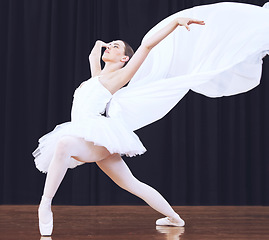 Image showing Ballet dance, stage performance and woman in theatre production, start of professional dancing competition and moving with costume. Ballerina dancer student with balance in concert at school