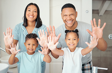 Image showing Parents, children and cleaning hands as a happy family in a bathroom together at home with a proud mother and father. Smile, dad and healthy mom enjoys a wellness and cleanliness lifestyle with kids