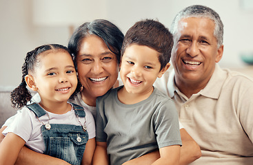 Image showing Grandparents portrait, love hug and children with smile for relax on living room sofa, happy in lounge together and family on couch in house. Elderly grandmother and man care for kids in apartment