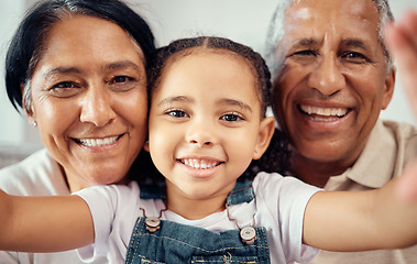 Image showing Selfie, face and girl bonding with grandparents, happy and smiling while relaxing at home together. Love, family and senior man and woman enjoy time with grandchild, love and caring pose for photo