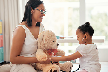 Image showing Teddy bear doctor, girl game and mother with smile for child, happy medical work and family love for healthcare in home. Girl and mom giving support and help playing nurse to toys in house together