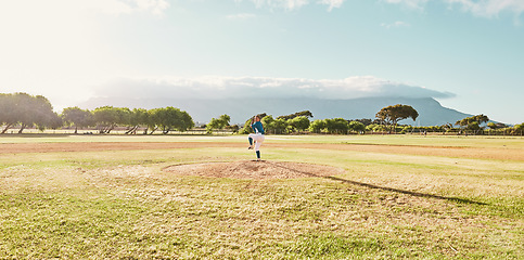 Image showing Panoramic of pitcher on field for a game of baseball, ready to pitch and throw the ball. Baseball player standing alone on pitchers mound on baseball field for practice, training and sports match