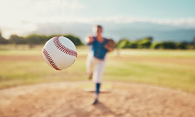 Image showing Baseball, sport and ball with a sports athlete or pitcher throwing and pitching a ball during a game or match on a court. Fitness, workout and exercise with an athletic person training outside