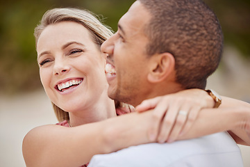 Image showing Happy, love and diversity couple with hug celebrate travel, engagement and vacation at sea, ocean or luxury beach. Smile or man and woman with happiness, laugh and bond time together or celebration