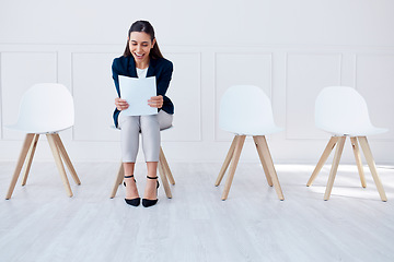 Image showing Paper, recruitment and hiring of business woman in a waiting room for a corporate company job interview. Excited, smile and contract for job success, promotion or new career while reading a document