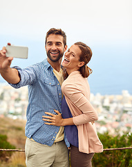 Image showing Couple, hug and selfie on vacation, laughing and outdoors on adventure, love and memories for social media. Happy people, smartphone and bonding or technology, travel and holiday or free on date