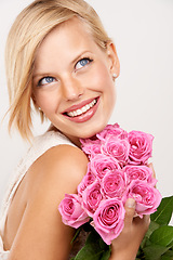 Image showing Thinking, pink roses or woman with flowers for beauty, natural skincare or wellness on white background. Ideas, glow or happy model with smile, valentines day gift or bouquet for a present in studio