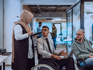 Image showing Young group of business people brainstorming together in a startup space, discussing business projects, investments, and solving challenges.